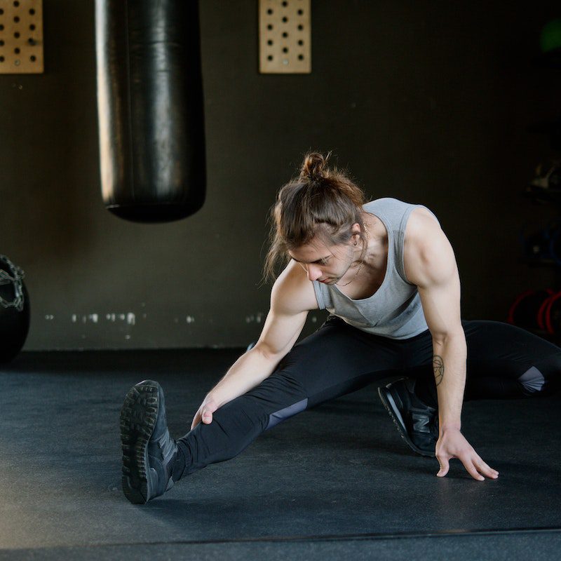 Man Stretching at a Gym<br />
